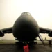 a large black airplane on a runway